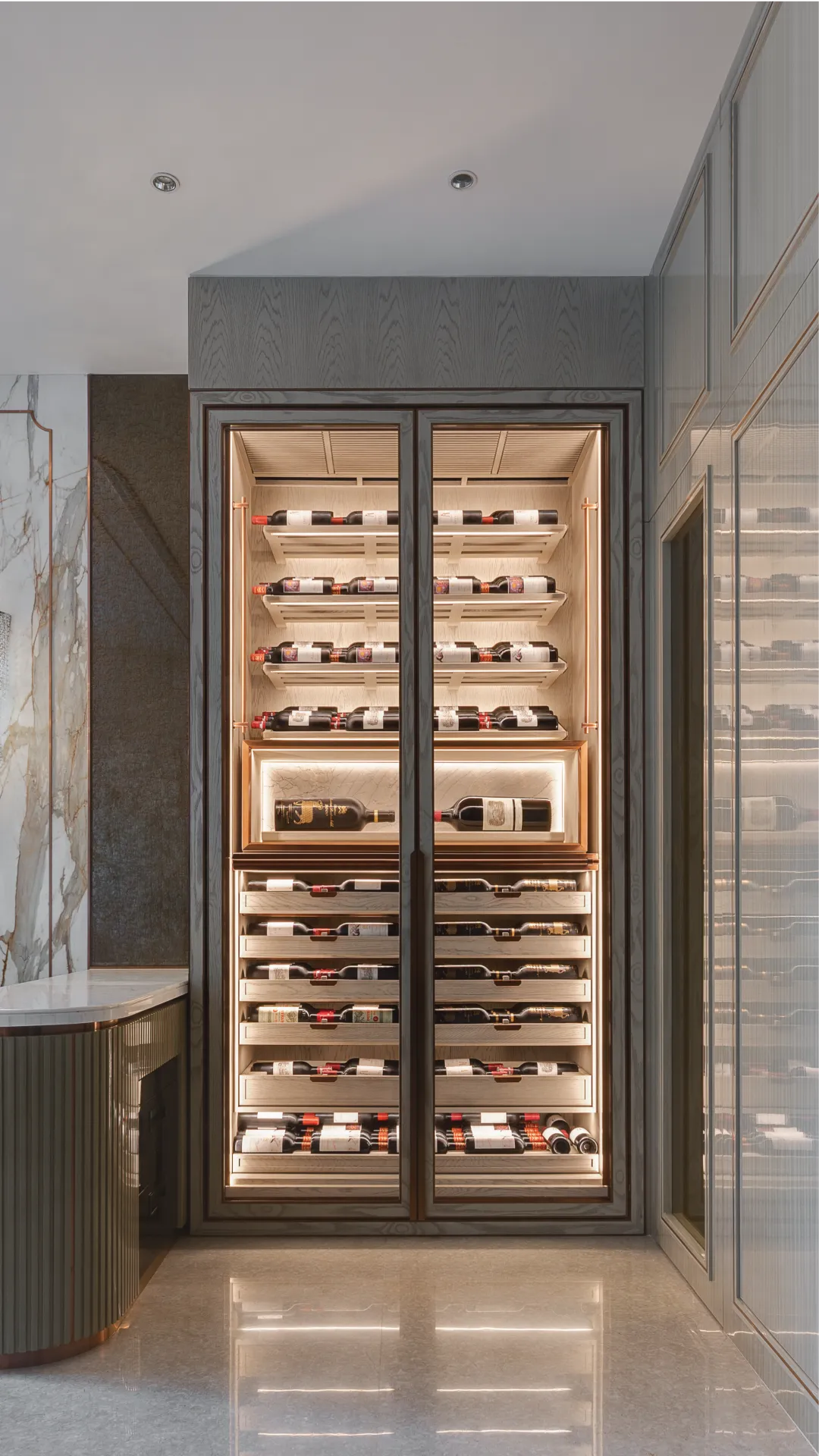 Sensis wine cabinet set into a marble wall